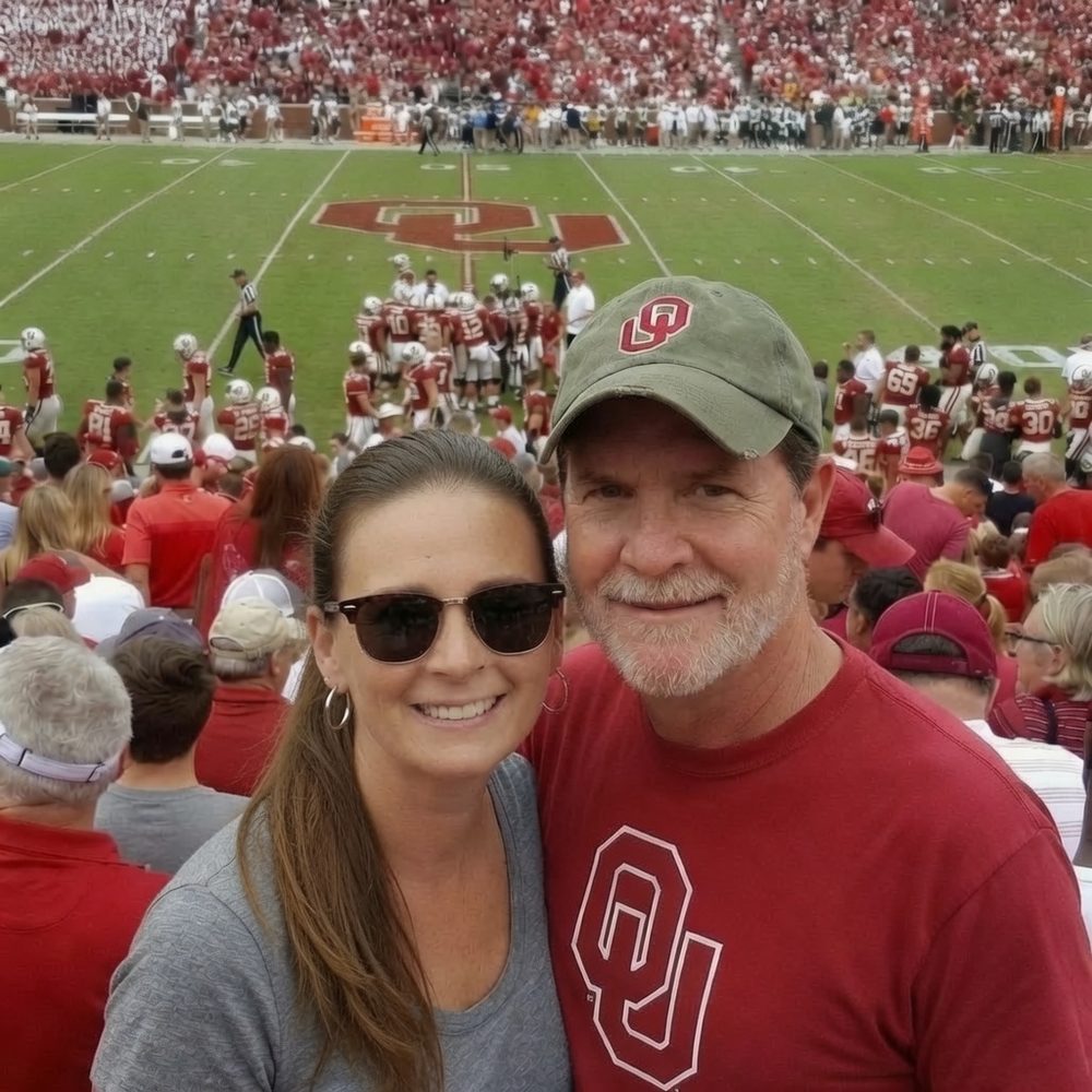 Darin and Sally Ray cheering at an Oklahoma football game